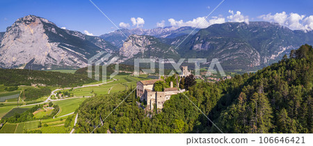 Italy travel destinations. Famous medieval castle Madruzzo in Trentino Alto Adige region province of Trento. Aerial panoramic drone view 106646421