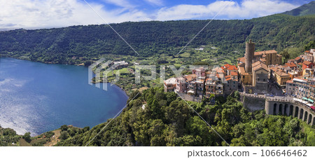 Most scenic lakes of Italy - volcanic Lago di Nemi , aerial drone view of Nemi village and volcano crater. popular touristic site near Rome 106646462