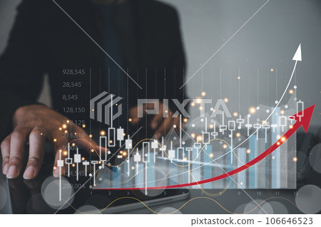 Businessman holding a tablet and presenting a virtual hologram of a stock market chart with an upward arrow. Planning and strategy for business growth. Technology and data analysis is crucial. 106646523