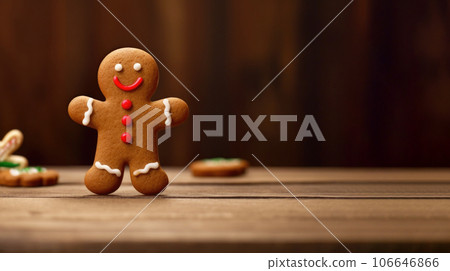 Gingerbread man dancing on the wooden kitchen table, copy space 106646866