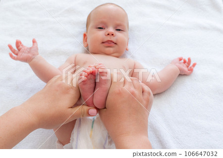 Mother alleviates baby's discomfort. Concept of infant colic relief 106647032