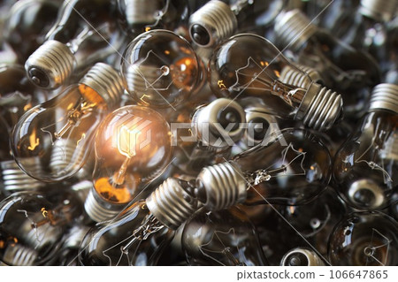 Heap of used old fashioned light bulbs Heap of used old fashioned light bulbs 106647865