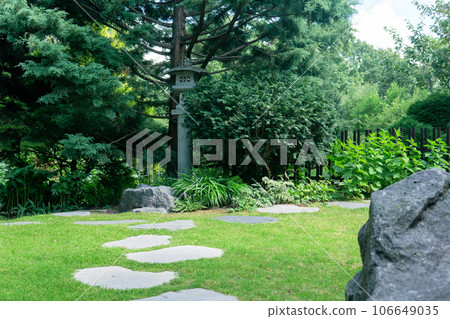 japanese garden landscape with stone lantern under pine tree 106649035