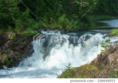 natural landscape with a clear waterfall on a forest river 106649053