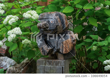 funny wooden garden figurine, carelessly carved funny wooden garden figurine, carelessly carved 106649054
