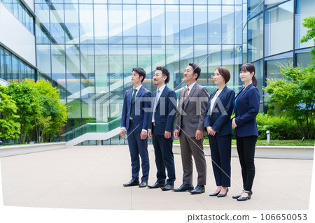 Portrait of a business person standing in front of an office building 106650053