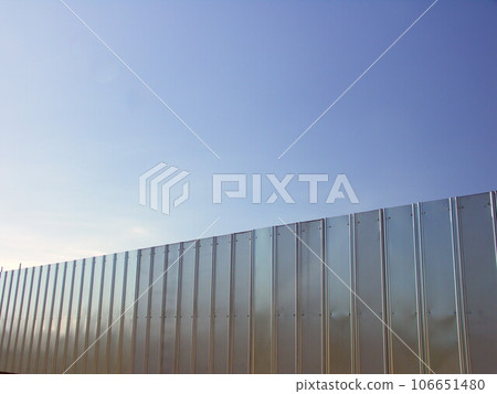 Material storage fence and winter blue sky Material storage fence and winter blue sky 106651480