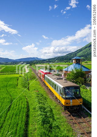 With the mountain range of Aso in the background, the tourist train Sunny Train and Minami Aso Water Village Hakusui Kogen Station "Minami Aso Railway, all lines open" 106652666
