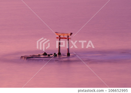 The torii gate of the former Tomisaki Shrine in Katsuura Bay standing on the sea in the afterglow The torii gate of the former Tomisaki Shrine in Katsuura Bay standing on the sea in the afterglow 106652995