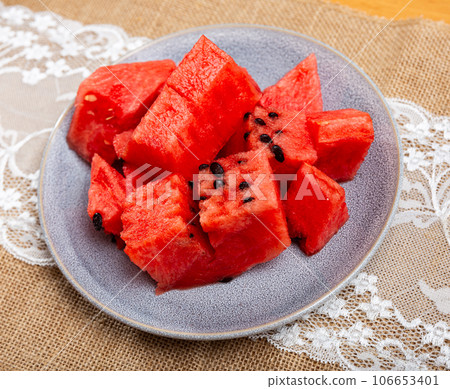 Juicy and refreshing slices of ripe watermelon on plate Juicy and refreshing slices of ripe watermelon on plate 106653401