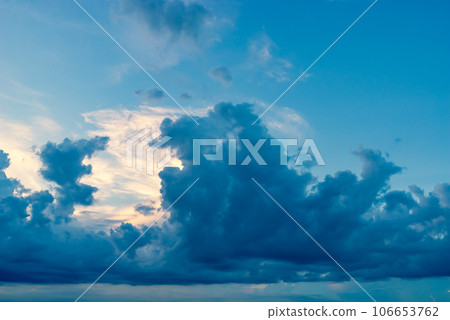 Black clouds bubbling up in the summer blue sky b-4 Warm colors and cold colors emphasized 106653762