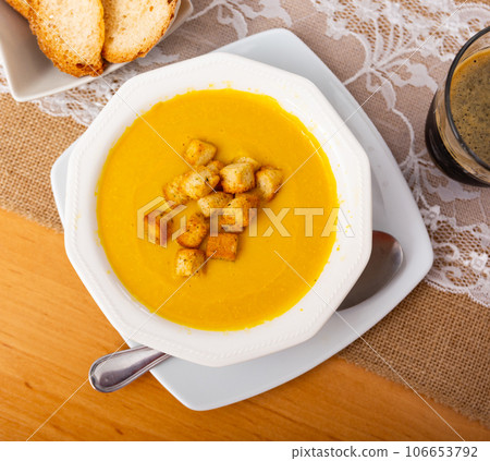 Carrot cream with croutons Carrot cream with croutons 106653792