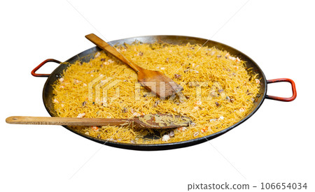 Cooking the Valencian dish Fideua de Marisco Cooking the Valencian dish Fideua de Marisco 106654034