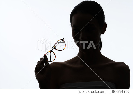 Silhouette of a woman with glasses Silhouette of a woman with glasses 106654502