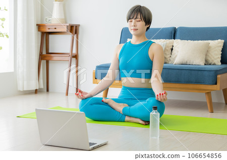 Instructor teaching yoga remotely 106654856