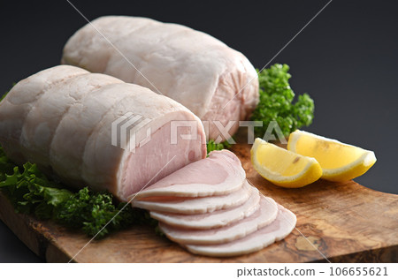 Blocks and slices of delicious white loin ham Appetizing white loin ham on a cutting board 106655621