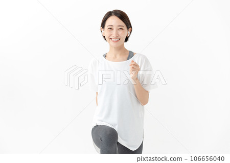 Healthy smiling woman walking and stretching 106656040