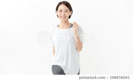 Healthy smiling woman walking and stretching 106656041