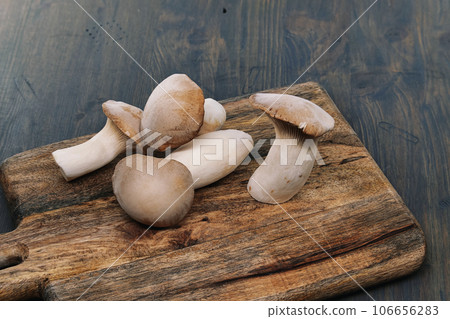 Group of king oyster mushroom on cutting board 106656283