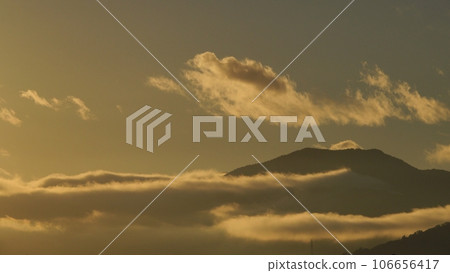 Silhouette of a sea of clouds and Kishu Fuji illuminated by the early autumn morning sun, telephoto, 230905am Silhouette of a sea of clouds and Kishu Fuji illuminated by the early autumn morning sun, telephoto, 230905am 106656417
