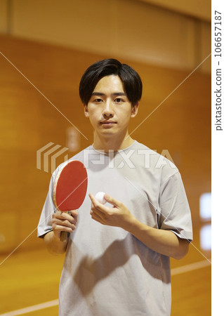 Japanese male university students practicing table tennis in the gymnasium. Japanese male university students practicing table tennis in the gymnasium. 106657187