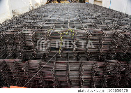 Bundle of wiremesh metal floor lean construction site building 106659476
