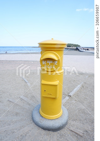 yellow mailbox on the coast 106659987