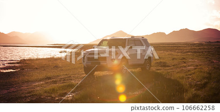 Driving White 2020 Toyota 4Runner TRD crossing in the sunset lakeside trip Driving White 2020 Toyota 4Runner TRD crossing in the sunset lakeside trip 106662258
