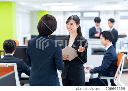 A businessman having a meeting in the office A businessman having a meeting in the office 106662669