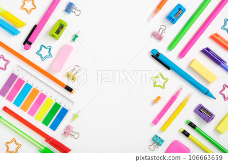 Creative layout made of neon colorful stationery set on white background. Space for your text Creative layout made of neon colorful stationery set on white background. Space for your text 106663659
