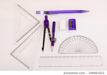 Colored pencils on white background, India 106663822