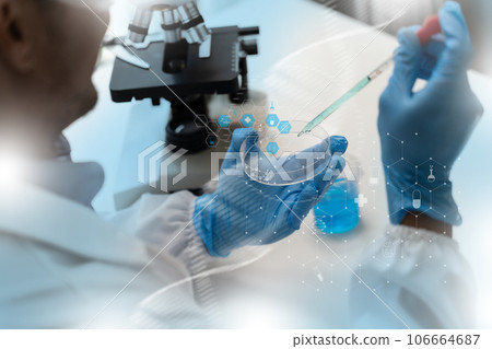 Man doctor biochemical research DNA scientist working with microscopical research in a lab Analysis of Biotechnology Specialist working with Advanced Equipment Man doctor biochemical research DNA scientist working with microscopical research in a lab Analysis of Biotechnology Specialist working with Advanced Equipment 106664687