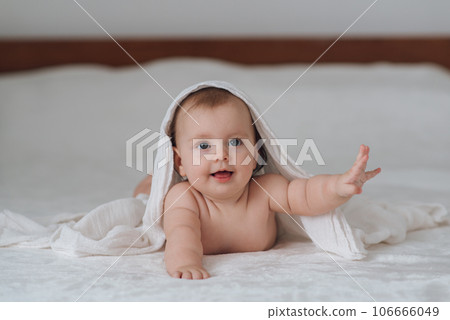 A cute five-month-old baby in the bedroom. High quality photo A cute five-month-old baby in the bedroom. High quality photo 106666049