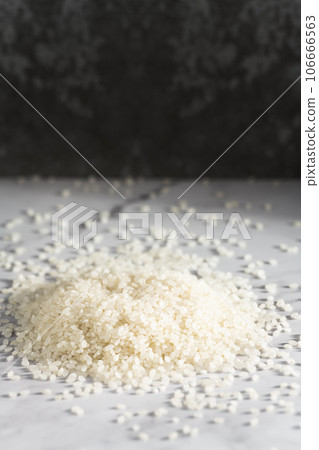 Rice on a marble slab under the sunlight. Rice on a marble slab under the sunlight. 106666563