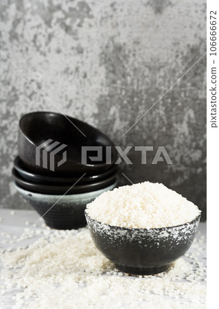 Rice in a bowl, illuminated by sunlight. 106666672