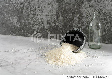 Rice in a bowl, illuminated by sunlight. Rice in a bowl, illuminated by sunlight. 106666745