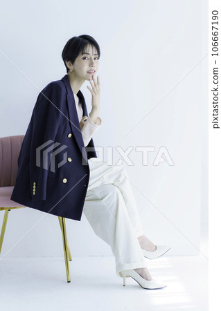 Full body fashion portrait of a young woman wearing a jacket on a white background, vertical position 106667190
