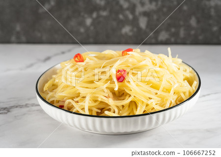 Stir-fried shredded potatoes on the slate table 106667252