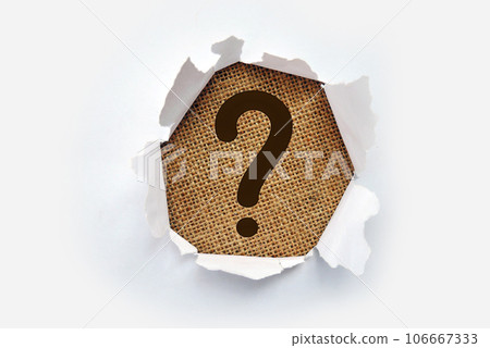 Torn out white paper with question mark symbol. White torn paper revealing question mark symbol on Pink paper. Torn out white paper with question mark symbol. White torn paper revealing question mark symbol on Pink paper. 106667333