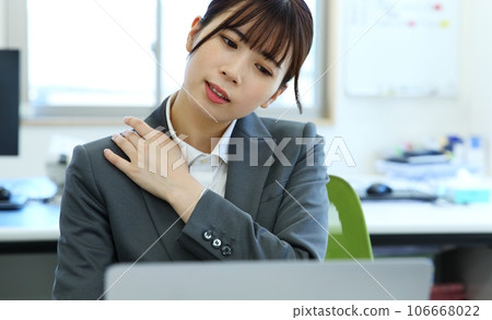 Image of a female office worker who feels tired 106668022