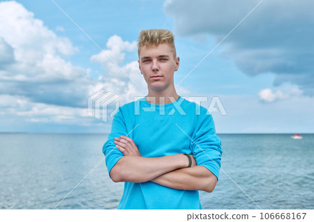 Portrait of serious confident young guy outdoor, on sea beach Portrait of serious confident young guy outdoor, on sea beach 106668167