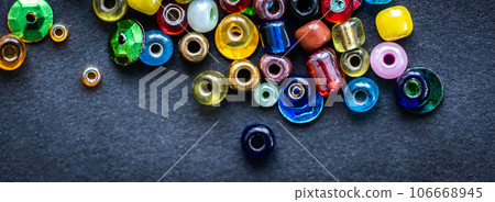 Top view of colorful glass beads 106668945