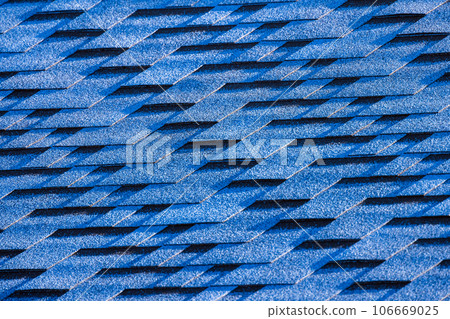 Blue roof tiling made of flexible shingles, background photo texture Blue roof tiling made of flexible shingles, background photo texture 106669025