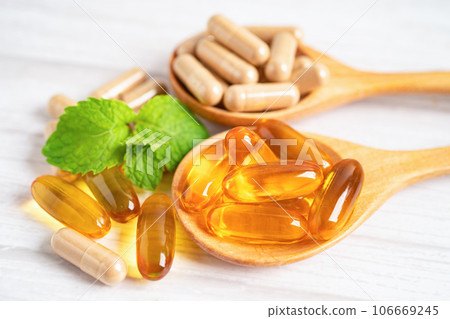 Alternative medicine herbal organic capsule with vitamin E omega 3 fish oil, mineral, drug with herbs leaf natural supplements for healthy good life. 106669245