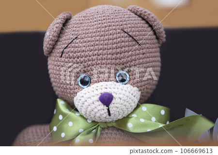 Funny handmade knitted bear close-up. Funny handmade knitted bear close-up. 106669613
