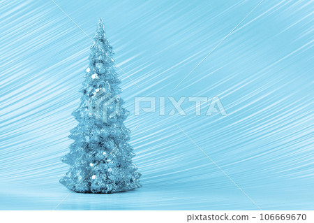 Christmas composition. Blue Christmas tree on a blue background. Happy Holidays. Minimal new year concept. 106669670