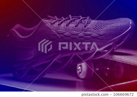 On a blue toned background, the silhouette of a sneaker on a skateboard. 106669672