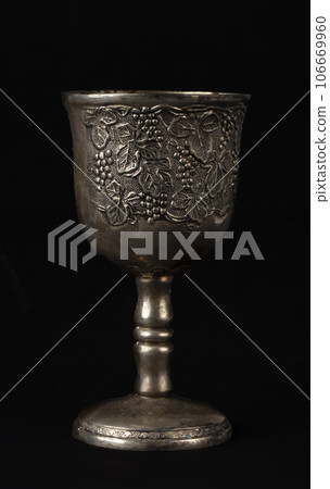 Antique silver royal goblet with grape engraving. 106669960