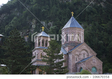 Beautiful Georgian church on the background of mountains. Beautiful Georgian church on the background of mountains. 106670358