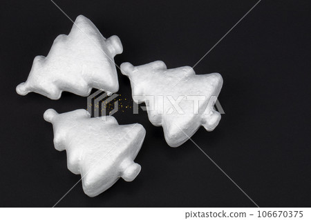 White toy Christmas tree on a black background. Happy Holidays. Minimal new year concept. 106670375
